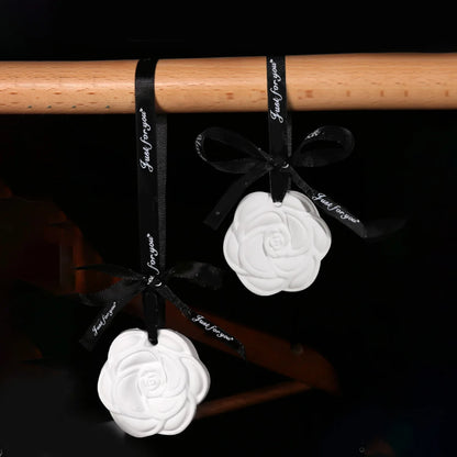Indoor ceramic stone fragrance diffuser hanging for home use solid light car aromatherapy camellia pendant decoration